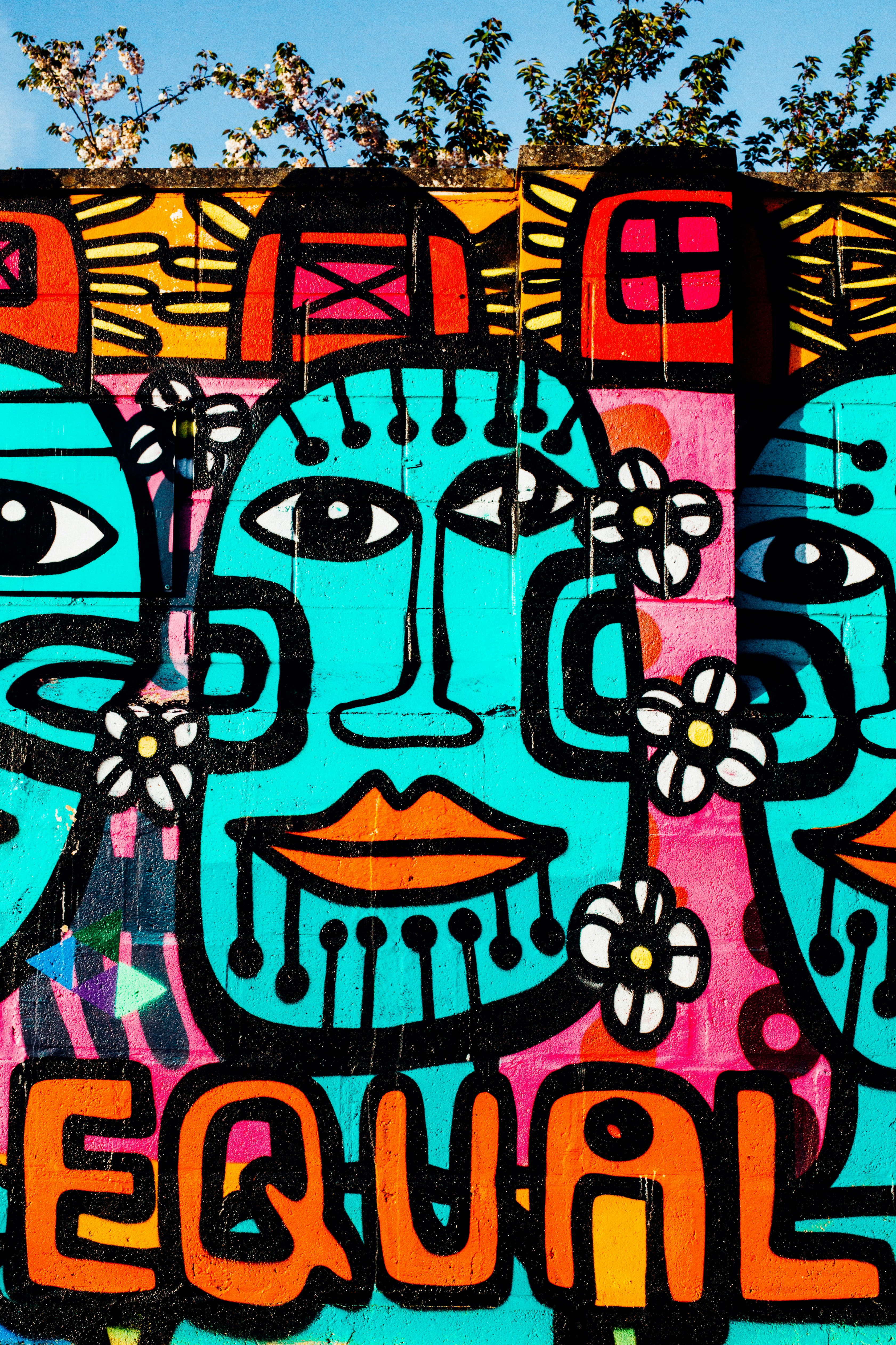 pink, teal, and orange graffiti wall art